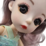 عروسک ناب سل مدل دختر چشم تیله ای کد B001 ارتفاع 20 سانتی متر - تصویر 13